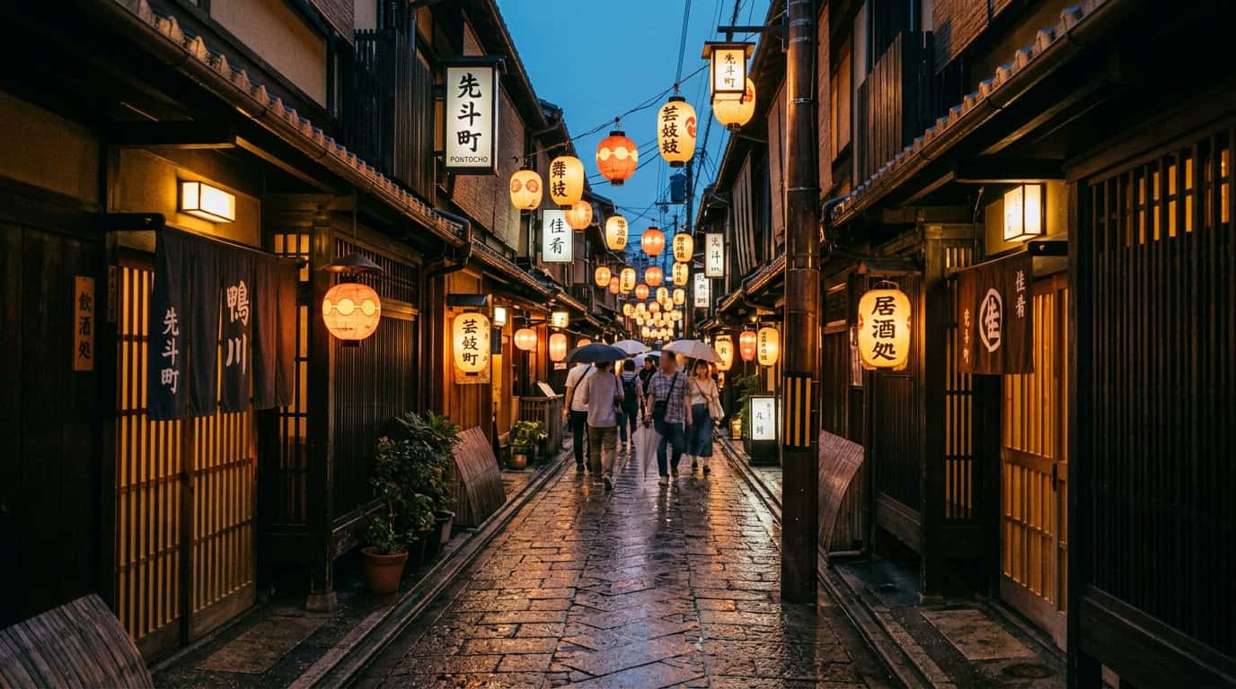 A long, slightly damp alleyway in Pontocho at dusk, illuminated